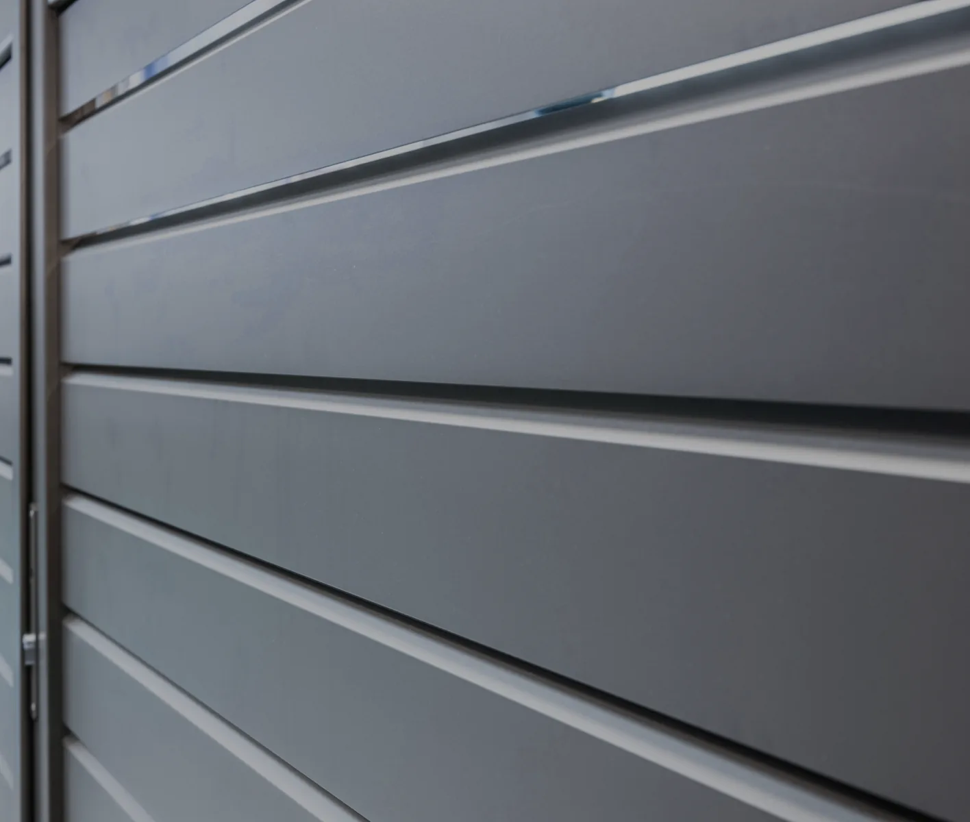 Close-up of the louvred slats of a powder-coated aluminium gate