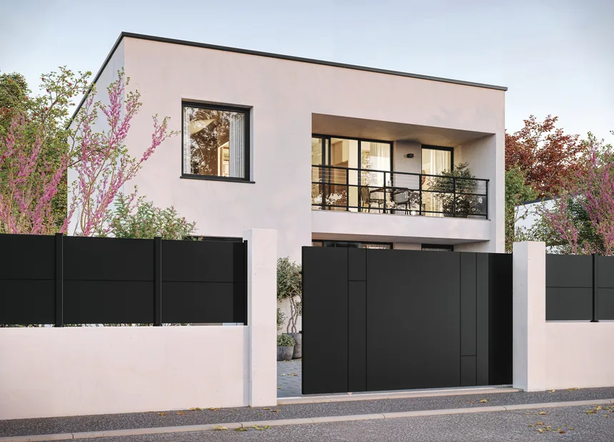 Kostum aluminium sliding gate and railing in front of a contemporary house