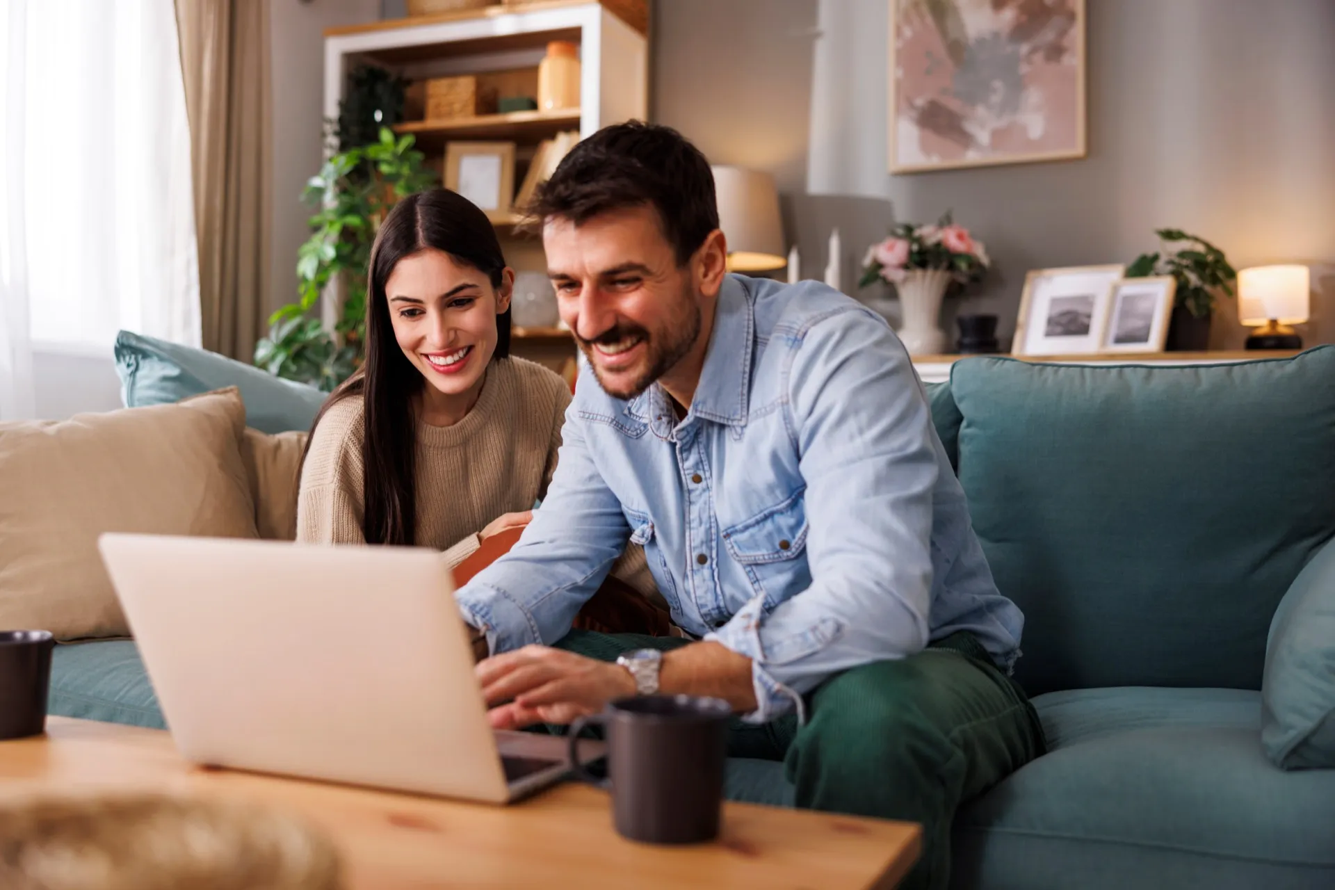 A couple registering their Kostum product from their living room