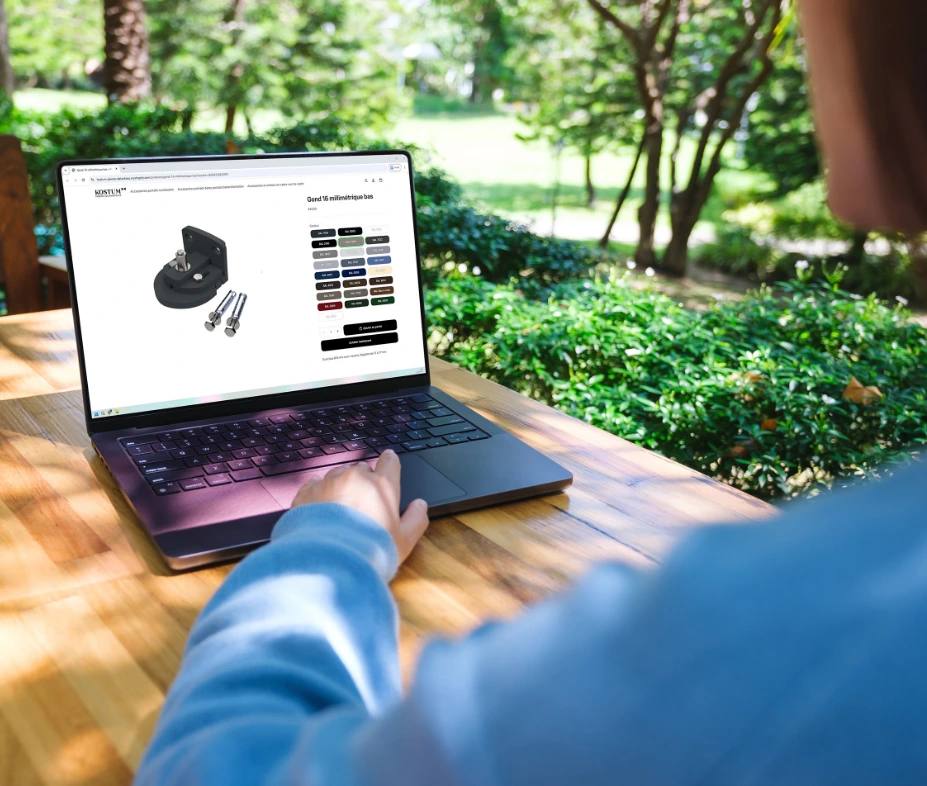Kostum spare parts online shop displayed on a laptop