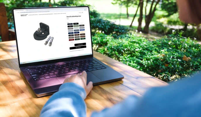 Kostum spare parts online shop displayed on a laptop